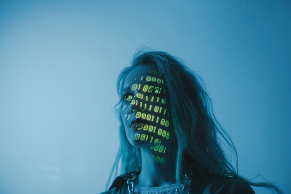 image A woman with long hair illuminated by a green light